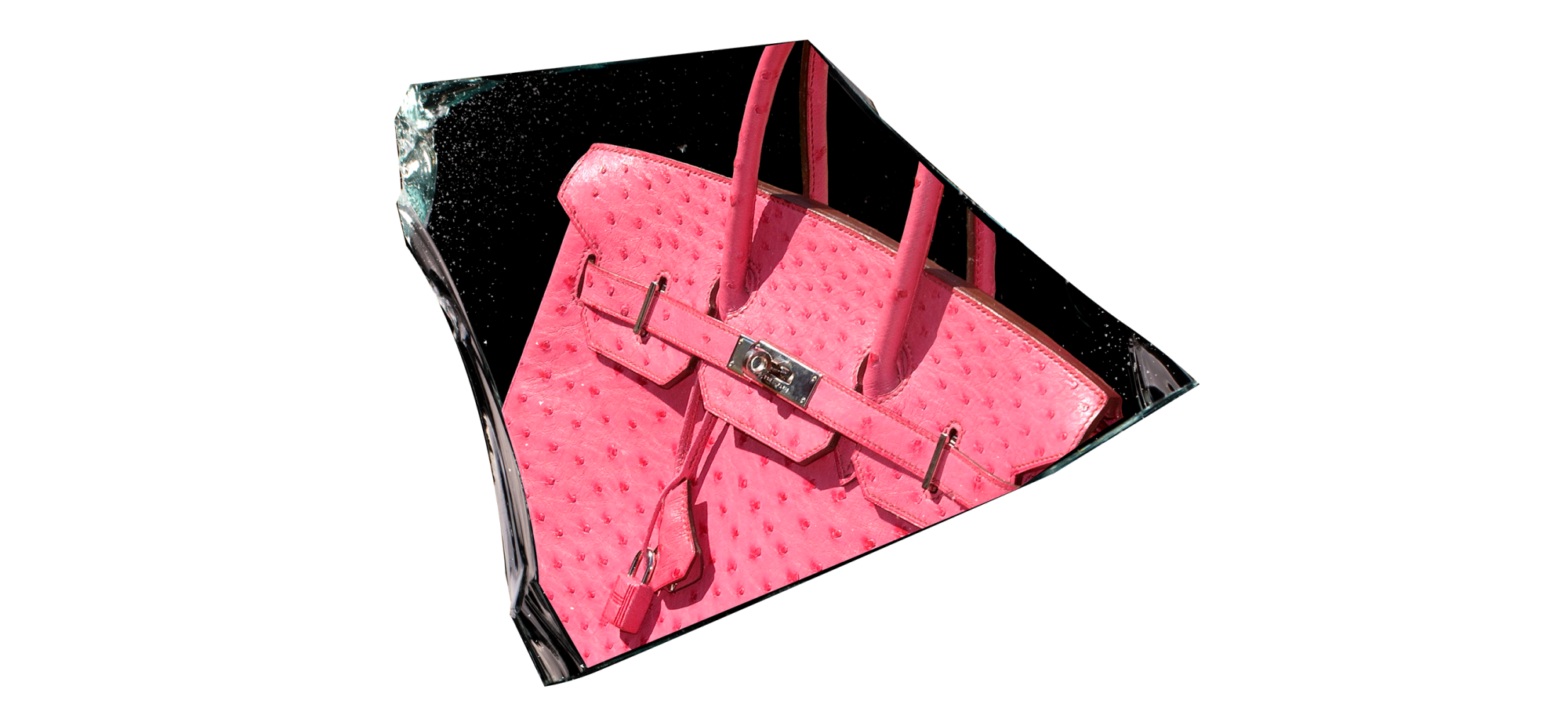 A pink Birkin bag superimposed onto a dark shard of glass