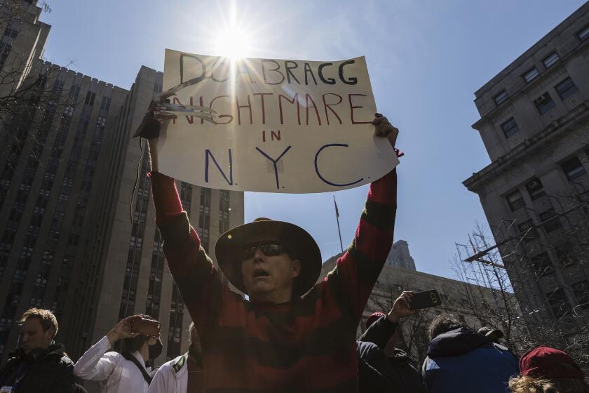 A Trump Supporter dressed as Freddy Krueger at a protest held in Collect Pond Park across the street from the Manhattan District Attorney's office in New York on Tuesday, April 4, 2023. (AP Photo/Stefan Jeremiah)