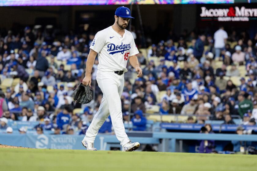 LOS ANGELES, CA - APRIL 14, 2024: Los Angeles Dodgers pitcher J.P. Feyereisen (45) leaves the game after giving up a 3-run double to San Diego Padres outfielder Jurickson Profar (10) in the seventh inning at Dodger Stadium on April 14, 2024 in Los Angeles, California.(Gina Ferazzi / Los Angeles Times)