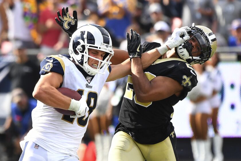 Wally Skalij  Los Angeles Times RAMS WIDE RECEIVER Cooper Kupp stiff-arms Saints cornerback Marshon Lattimore to get loose on his 66-yard pass play in the fourth quarter. Kupp’s long catch and run set up Jared Goff’s one-yard quarterback sneak for a touchdown and a 27-9 advantage.