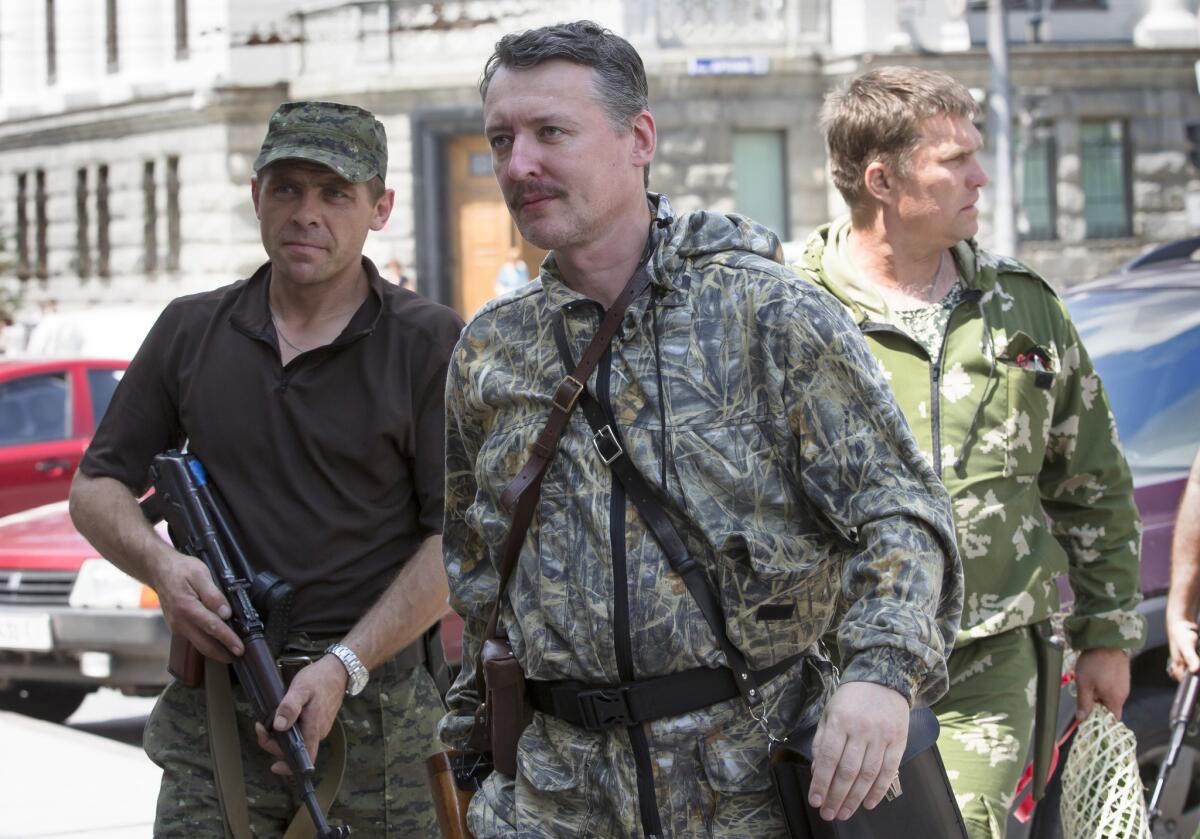 Igor Girkin, also known as "Strelkov," which means Shooter, resigned as the pro-Russia separatists' military commander on Thursday. He is seen here in a July 11 photo arriving for a fellow militant's wedding in Donetsk.