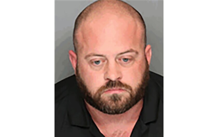 A booking mug shot of San Joaquin County correctional officer Zachary Simmons