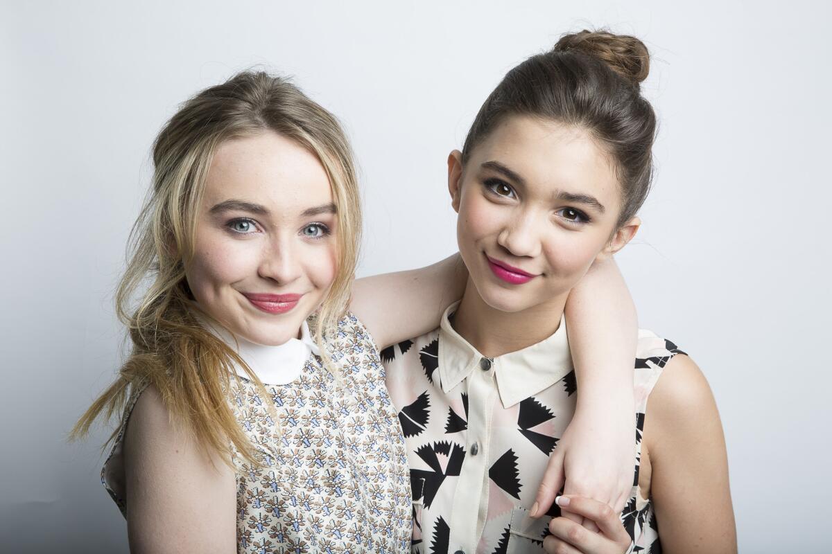 Sabrina Carpenter, left, who plays Maya, and Rowan Blanchard, who plays Riley, of the new Disney show "Girl Meets World" have inspired a clothing collection for tweens.