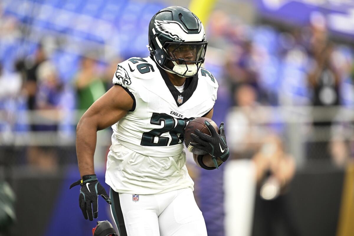 Philadelphia Eagles running back Saquon Barkley (26) works out before a preseason game.