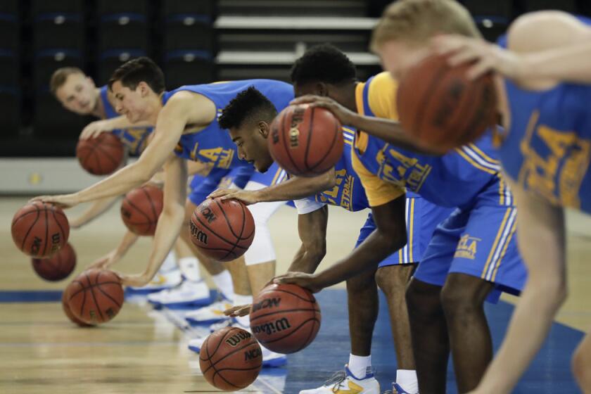 UCLA players run a drill during the team's media availability on Oct. 12.