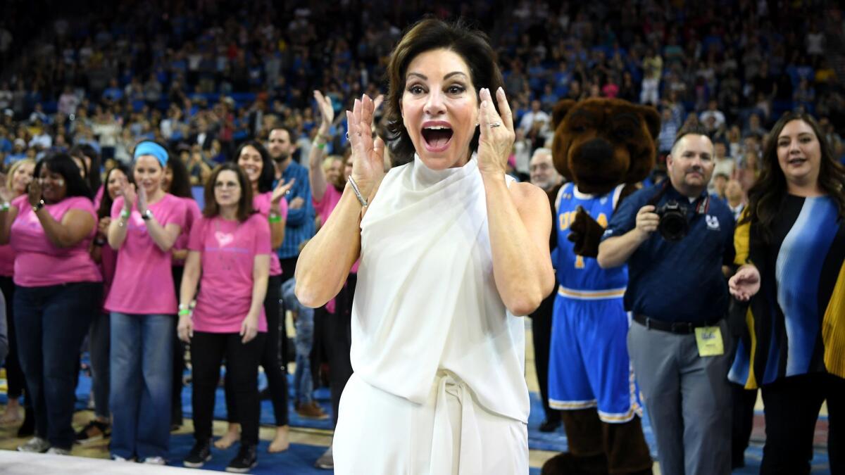 UCLA gymnastics coach Valorie Kondos Field reacts as the Utah State gymnastics team honors her during a retirement ceremony at Pauley Pavilion in March.