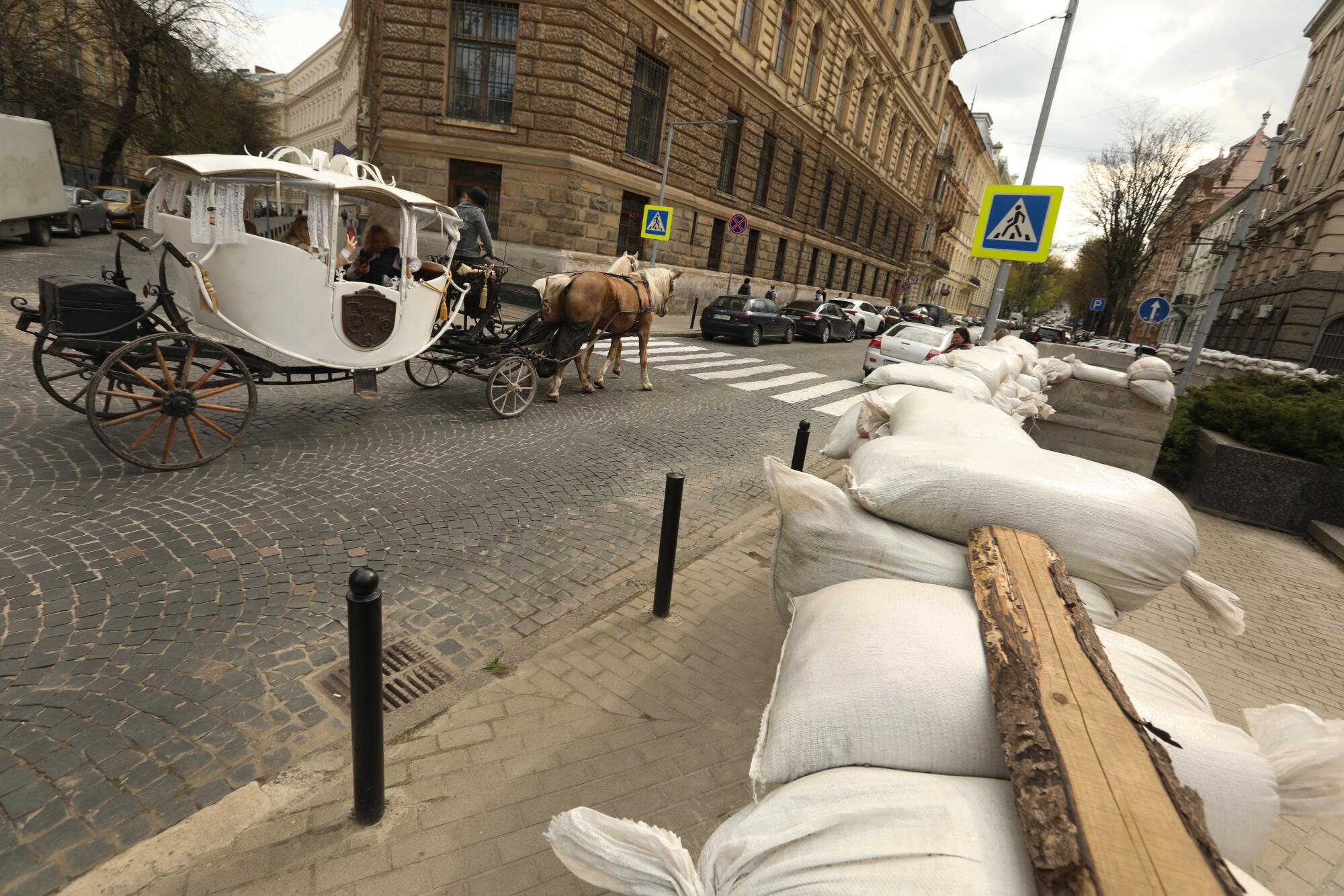 Sandbags line the barrier around a police station in downtown Lviv.