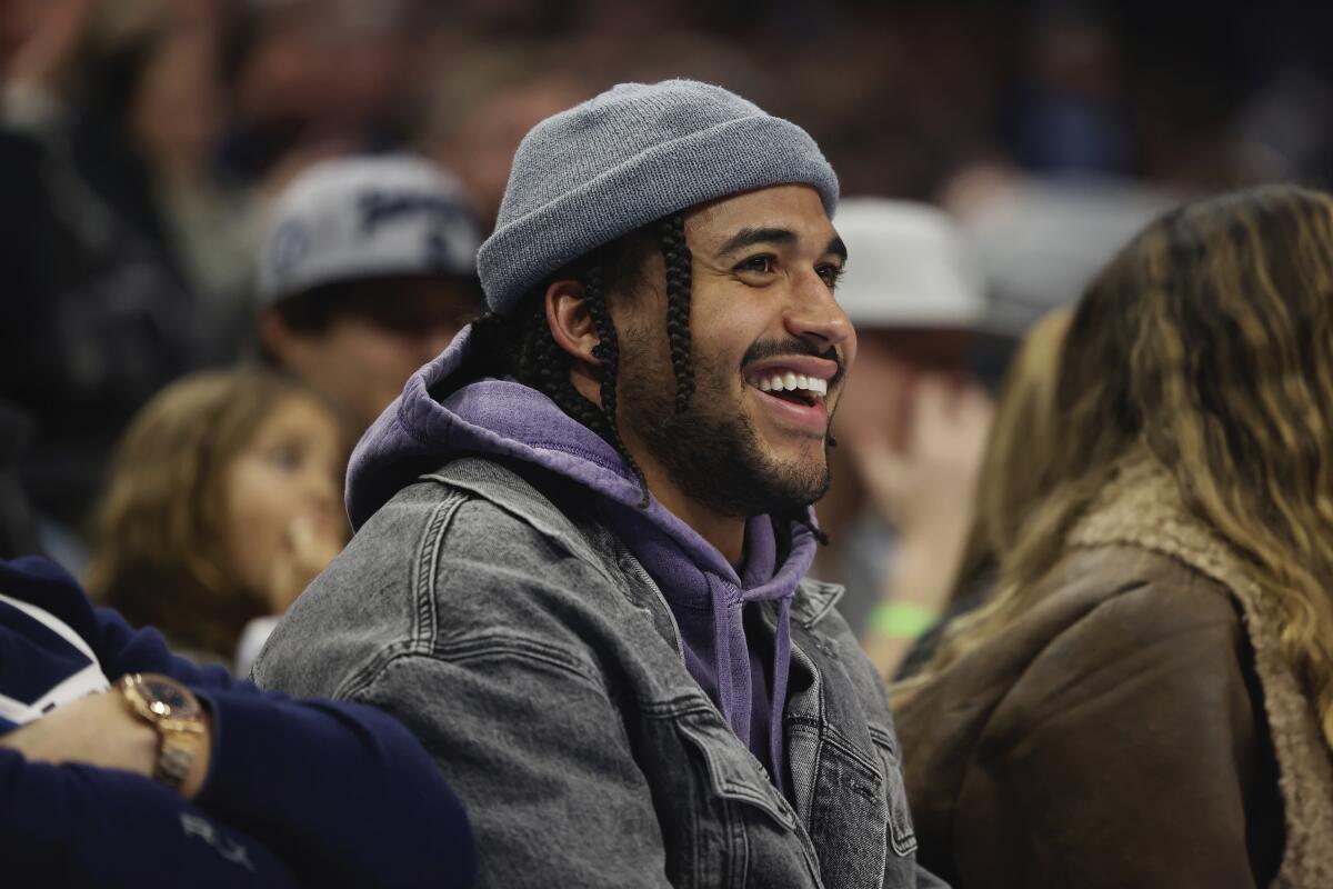 Former Vikings and current Chargers linebacker Eric Kendricks smiles while watching an NBA game in Minneapolis.