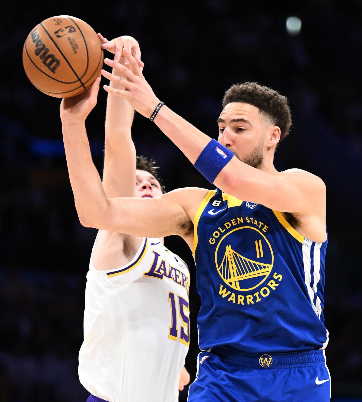 Lakers guard Austin Reaves blocks the shot of Warriors guard Klay Thompson during Game 3.