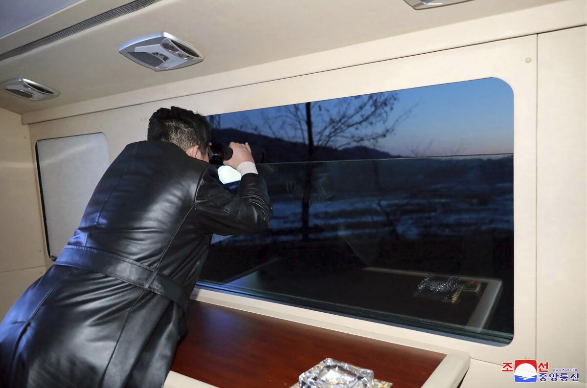 A photo provided by the North Korea purportedly shows leader Kim Jong Un watching the launch of a test missile last month.