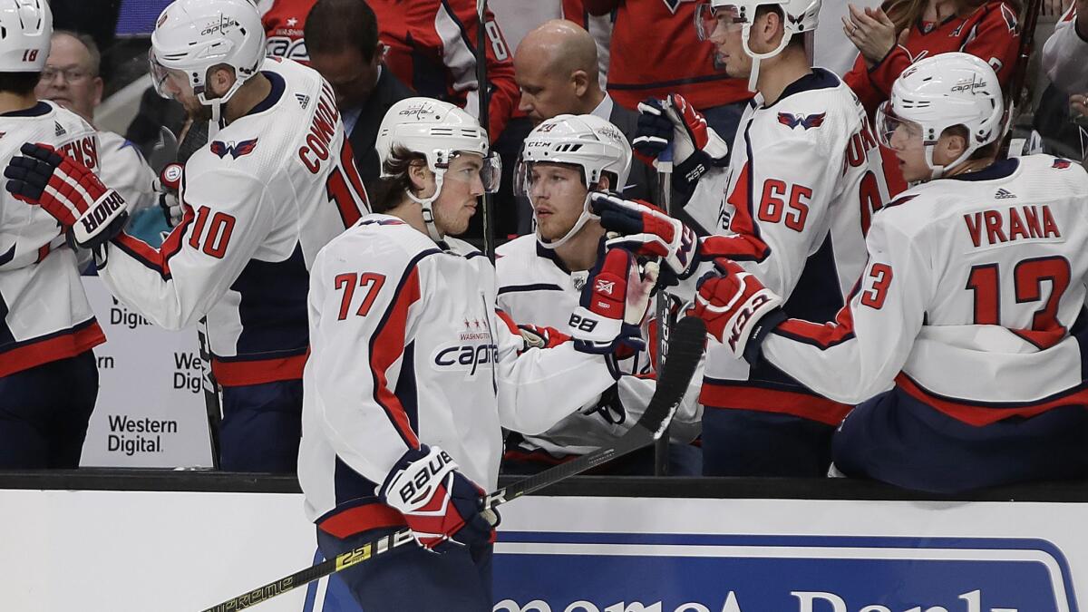 Washington Capitals' T.J. Oshie (77) is congratulated after scoring a goal against the San Jose Sharks in the first period Thursday.