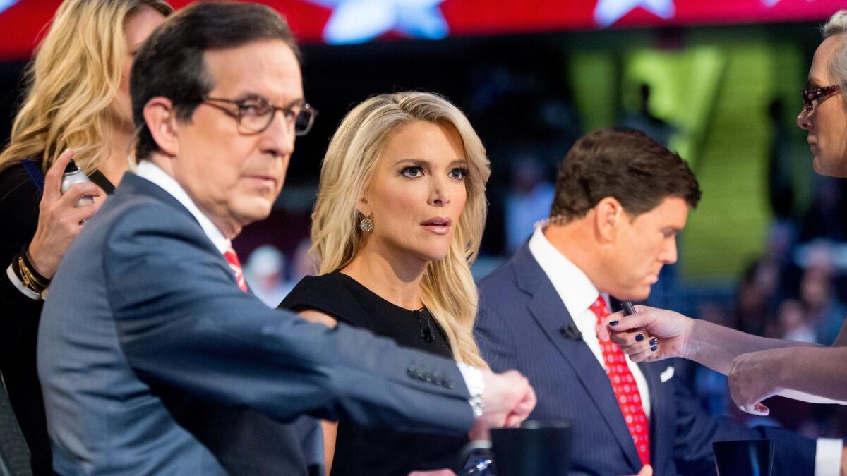 Fox News moderators Chris Wallace, from left, Megyn Kelly and Bret Baier during a Republican presidential debate Aug. 6, 2015, in Cleveland.