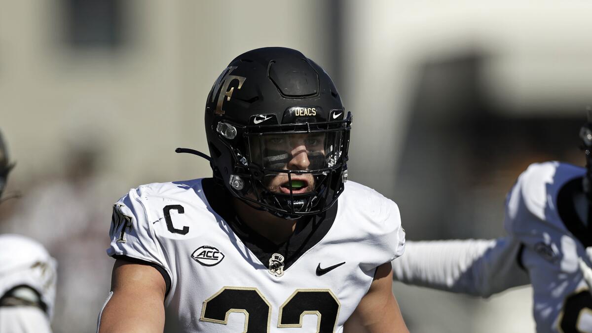 Army running back Anthony Adkins reacts against Wake Forest.