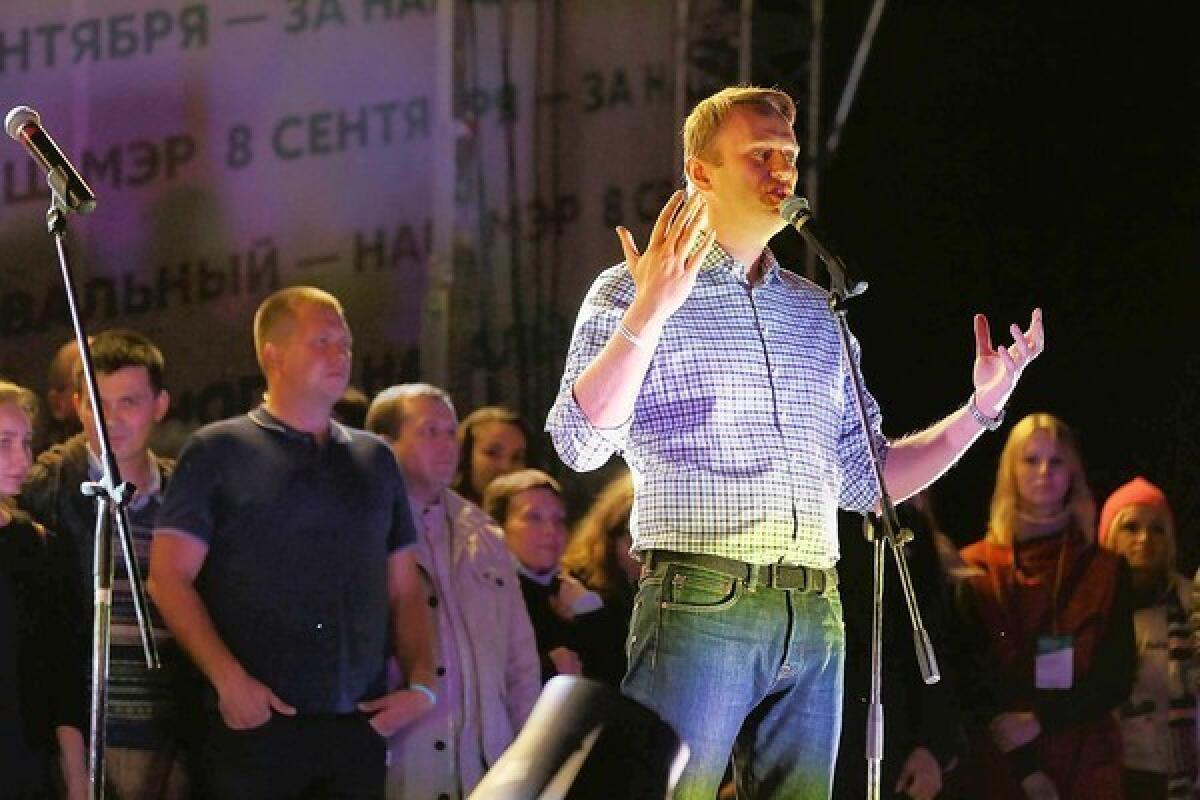 Opposition leader Alexei Navalny addresses thousands of his supporters at a downtown Moscow rally Monday night protesting alleged electoral fraud in Sunday's mayoral election.
