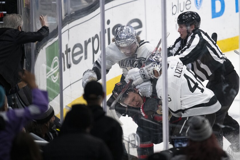 Ottawa Senators left wing Brady Tkachuk (7) gets into a brawl with Los Angeles Kings left wing Brendan Lemieux (48) and center Blake Lizotte (46) in the third period of an NHL hockey game Saturday, Nov. 27, 2021, in Los Angeles. (AP Photo/Kyusung Gong)