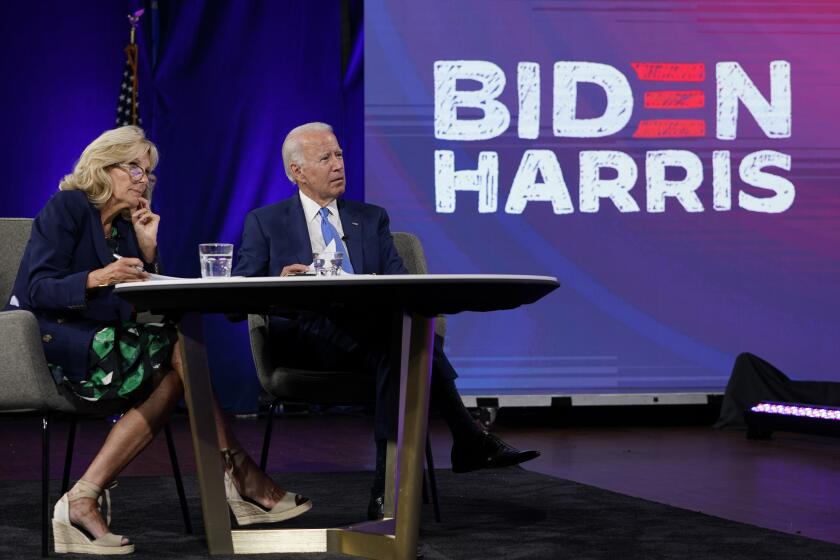 Democratic presidential candidate former Vice President Joe Biden, and his wife Jill Biden receive a briefing from education leaders and experts in Wilmington, Del., Wednesday, Sept. 2, 2020. (AP Photo/Carolyn Kaster)