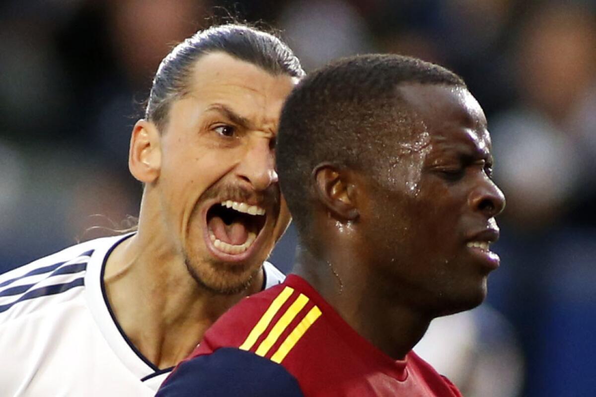 Zlatan Ibrahimovic #9 of Los Angeles Galaxy yells at Nedum Onuoha #14 of Real Salt Lake after scoring a goal during the second half of a game at Dignity Health Sports Park on April 28, 2019 in Carson, California.