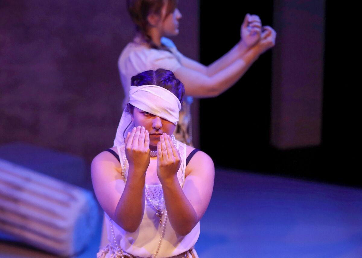 Chorus lead Kayla Witecki as she rehearses a scene from "Antigone" on Tuesday.