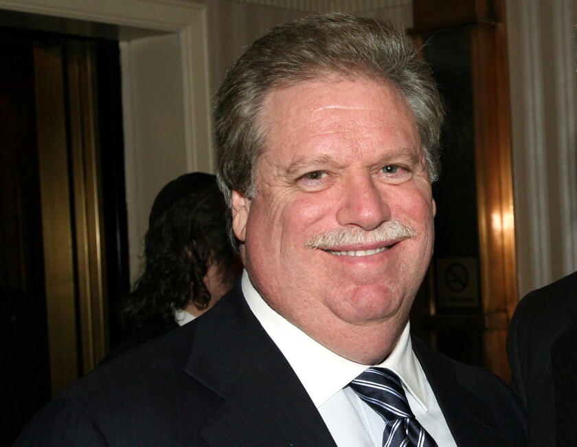 Elliott Broidy smiling in a suit and tie