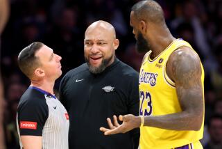 LOS ANGELES, CALIFORNIA - APRIL 9: Lakers head coach Marvin Ham and LeBron James argue with a referee against the Warriors in the third quarter at Crypto.com Arena Tuesday. (Wally Skalij/Los Angeles Times)