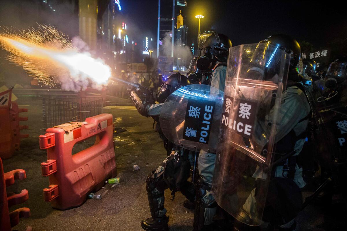 Police fire tear gas during a protest Aug. 4 in Hong Kong's Causeway Bay district.
