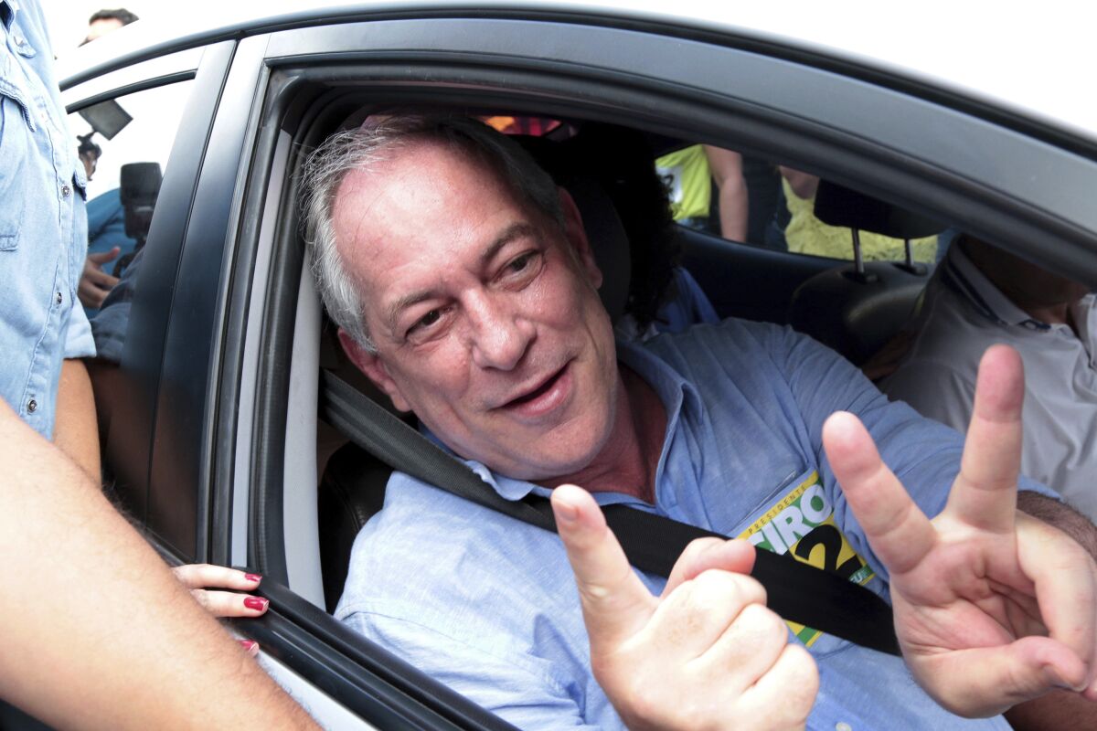 FILE - Ciro Gomes, presidential candidate of the Democratic Labor Party, flashes the number 12, his position on the ballot, after voting in general elections in Fortaleza, Brazil, Oct. 7, 2018. Brazil’s Federal Police on Dec. 15, 2021 searched Gomes' home, a politician expected to run for president again in 2022, as part of an investigation into corruption regarding works on a World Cup stadium in northeastern citiy Fortaleza. (AP Photo/Edmar Soares, FILE)
