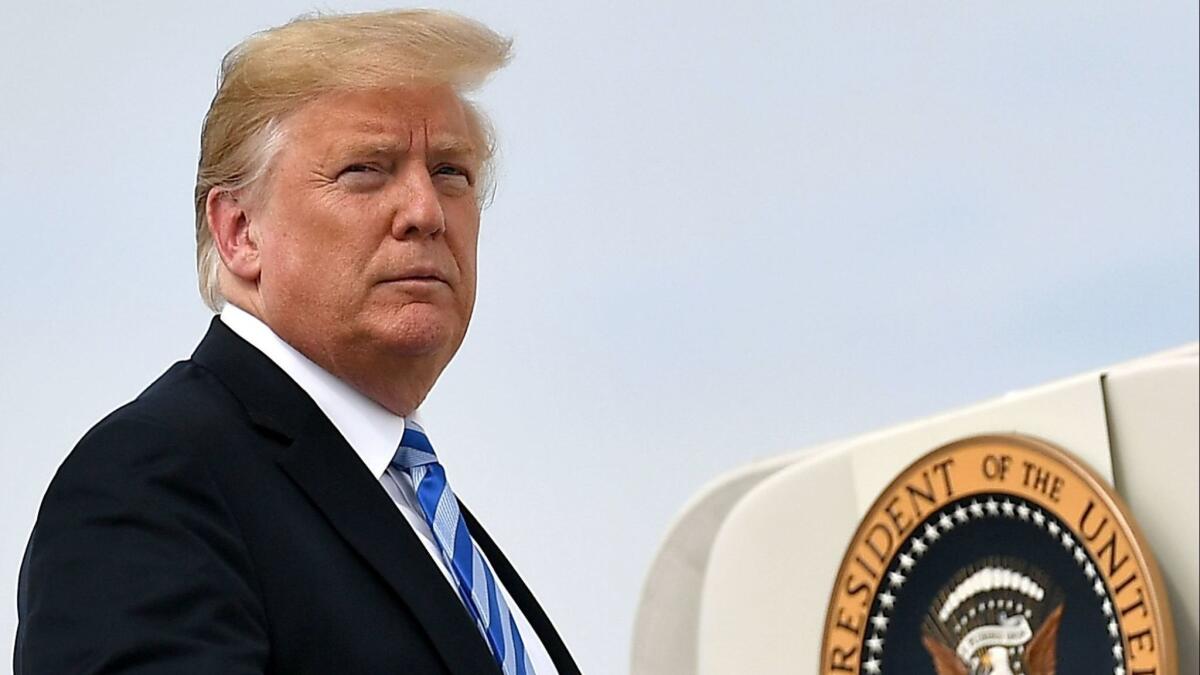 President Trump, seen boarding Air Force One, said on Aug. 23, "I will tell you what, if I ever got impeached, I think the market would crash. I think everybody would be very poor."