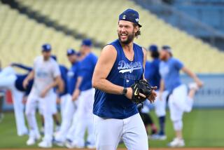 Los Angeles, California October10, 2022-Dodgers pitcher Clayton Kershaw has fun during a workout.