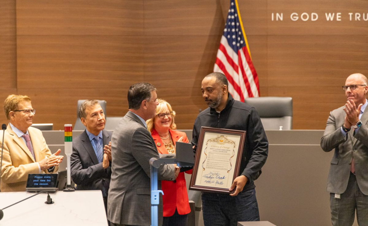 Yuri Williams is recognized for the charitable work of his nonprofit by the Orange County Board of Supervisors.
