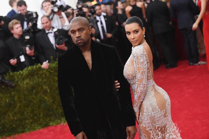 Kanye West and Kim Kardashian walk the Met Gala red carpet in 2015