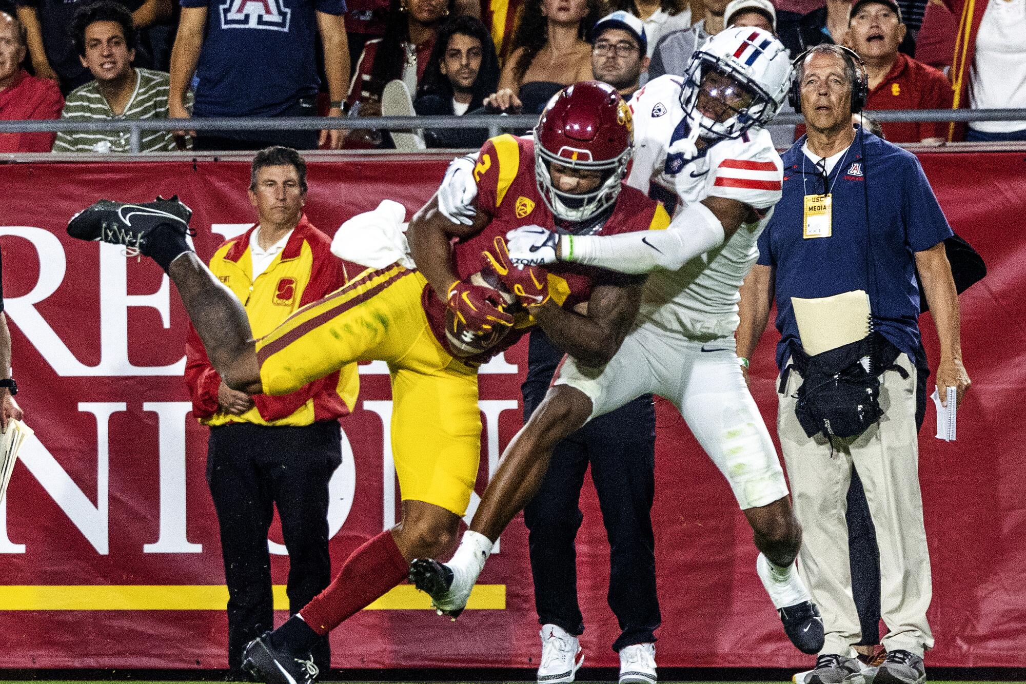 USC wide receiver Brenden Rice catches a pass in front of Arizona cornerback Ephesians Prysock.