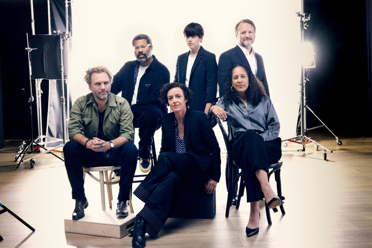 A group of directors, three men and three women, posing for a portrait.