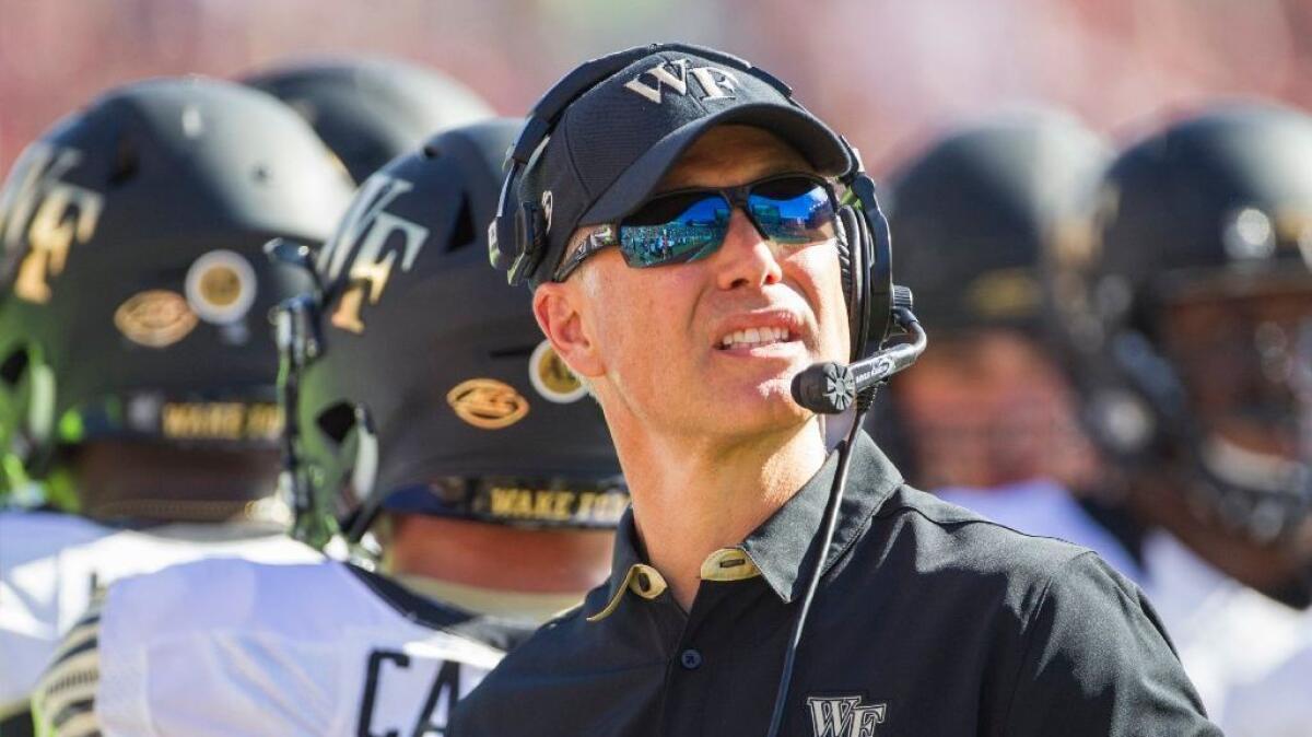 Wake Forest Coach Dave Clawson looks at the scoreboard during the first half of a game against Florida State on Oct. 15.
