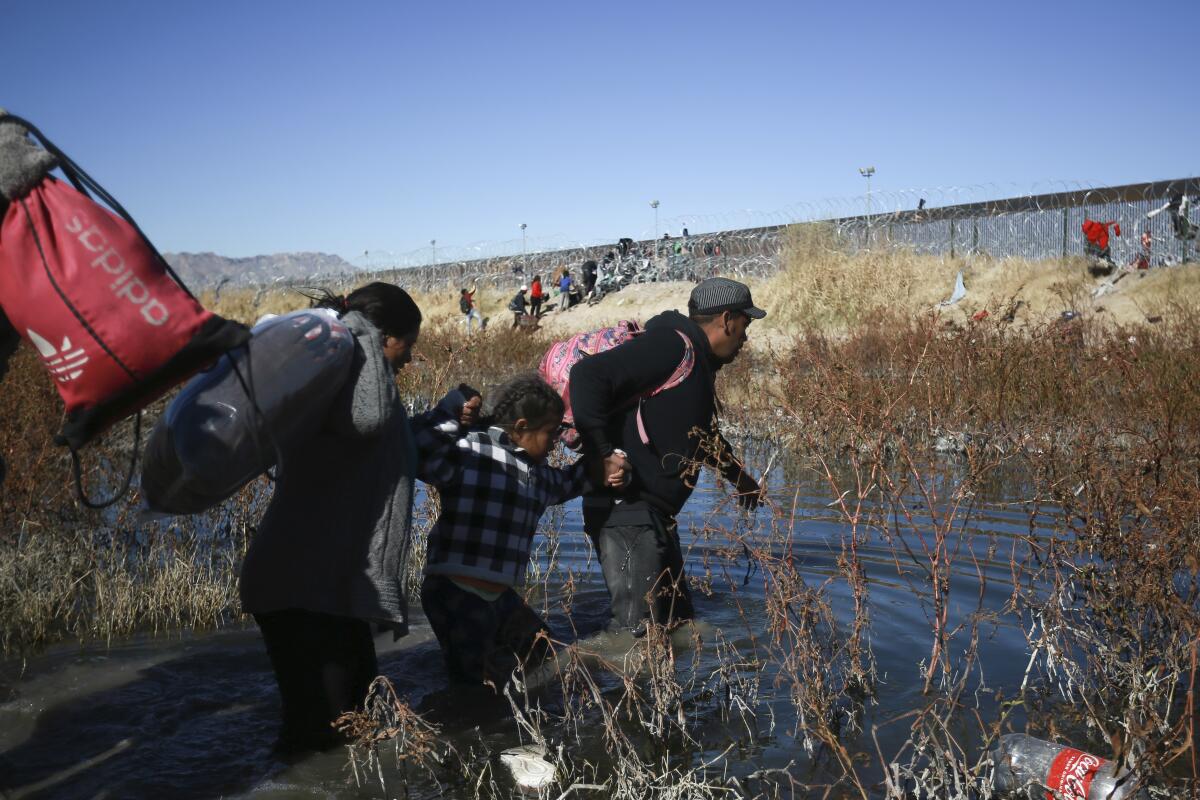 Migrants cross the Rio Grande to reach the United States from Ciudad Juarez, Mexico