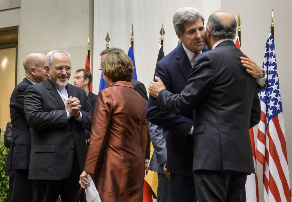 Iranian Foreign Minister Mohammad Javad Zarif, left, with EU foreign policy chief Catherine Ashton, center, and U.S. Secretary of State John F. Kerry with French Foreign Minister Laurent Fabius after a statement Sunday in Geneva announcing a deal with Iran on its nuclear program.