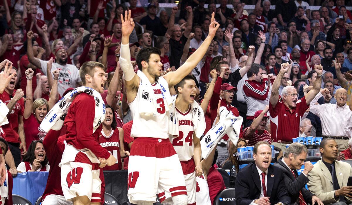 Wisconsin bench celebrates a three pointer during their, 79-72, win over North Carolina in the NCAA West Region semifinals at Staples Center on Thursday.