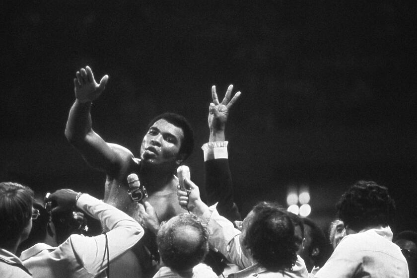 Muhammad Ali speaks to the press after a fight in New Orleans in 1978