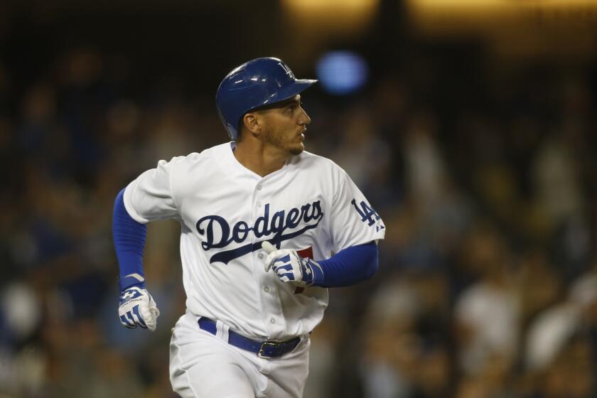 Dodgers' Alex Guerrero watches his two-run home run against the Mariners on April 14.