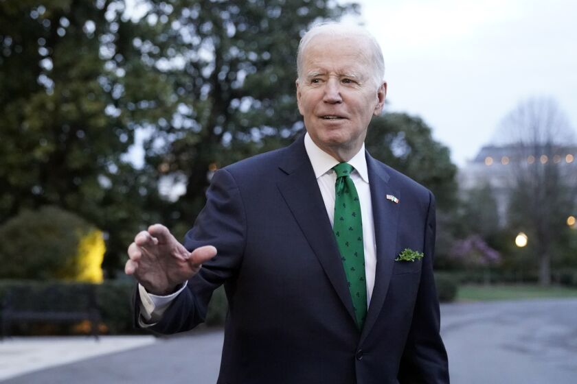 President Joe Biden waves as he walks to Marine One upon departure from the South Lawn of the White House, Friday, March 17, 2023, in Washington. Biden is headed to Delaware. (AP Photo/Alex Brandon)