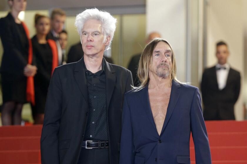 FILE - In this May 20, 2016 file photo, director Jim Jarmusch, left and singer Iggy Pop, pose at the screening of the film "Gimme Danger," at the 69th international film festival, Cannes, southern France. The film premieres Friday, Oct. 28, 2016, in Detroit and New York. (AP Photo/Lionel Cironneau, File)