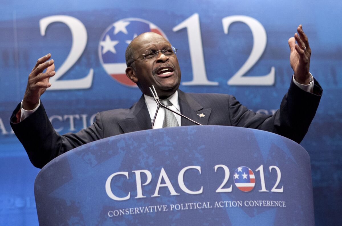 FILE - In this Feb. 9, 2012 file photo, former presidential candidate Herman Cain addresses the Conservative Political Action Conference in Washington. Cain has died after battling the coronavirus. A post on Cain's Twitter account on Thursday, July 30, 2020 announced the death. (AP Photo/J. Scott Applewhite, File)
