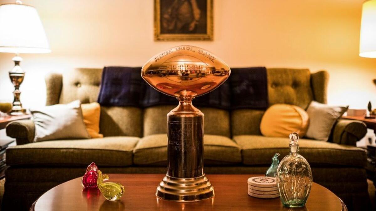 Jim Smith's Rose Bowl trophy sits on display in his home.