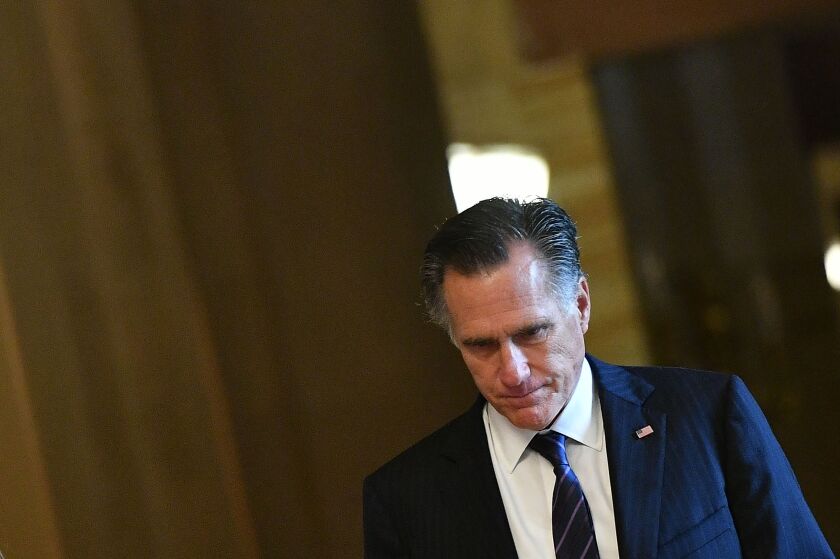 Sen. Mitt Romney returns from a recess during the impeachment trial of President Trump on Jan. 30. 