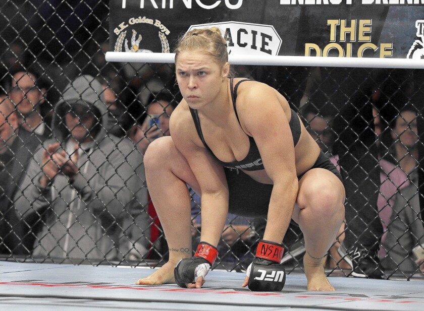 Ronda Rousey prepares for a title fight against Sara McMann in Las Vegas in February. The UFC star scored a disabling knee to McMann's gut for a TKO 66 seconds into their fight.