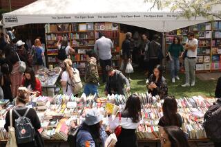 Los Angeles , CA - April 19: People look through an array of books to purchase during the LA Times Book Festival at USC campus on Friday, April 19, 2024 in Los Angeles, CA. (Michael Blackshire / Los Angeles Times)