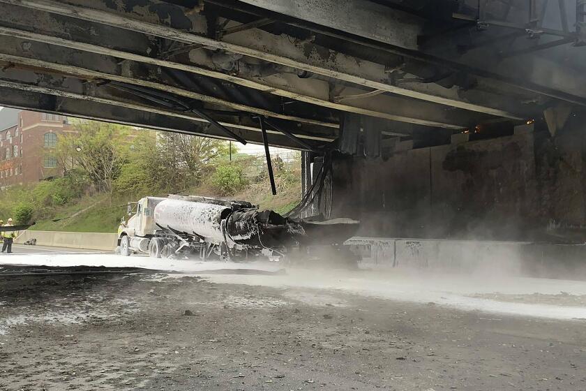 This image provided by the Norwalk Police Department shows the scene of a tanker fire on I-95 in Norwalk, Conn., Thursday, May 2, 2024. Both sides of I-95, the East Coast's main north-south highway, were shut down — causing “horrendous” traffic jams — following the early morning crash involving a passenger car, a tractor-trailer and a tanker truck carrying 8,500 gallons (about 32,000 liters) of gasoline. (Norwalk Police Department via AP)