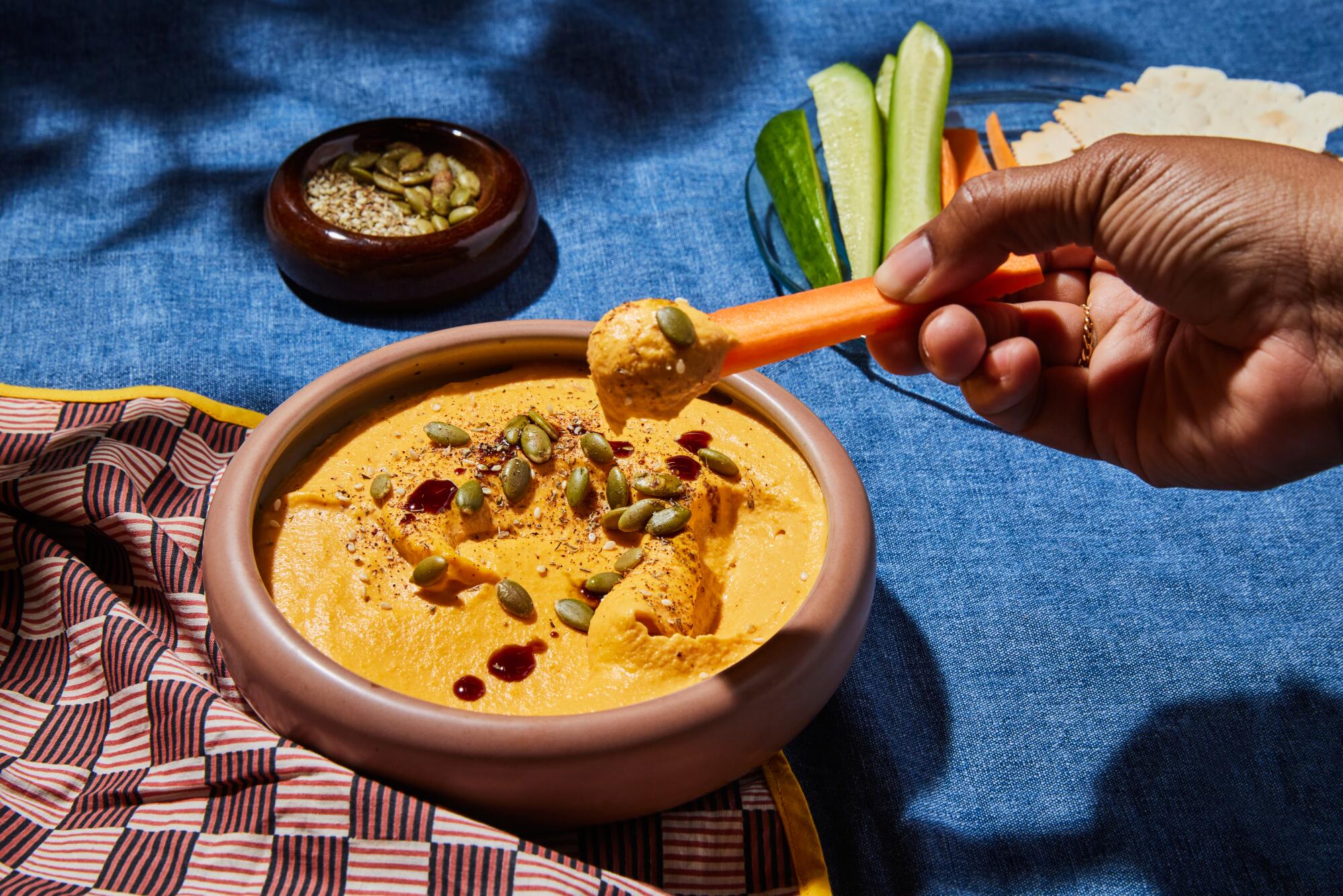 Butternut hommus, featured in "Zaytinya," garnished with pumpkin seeds and pomegranate molasses.