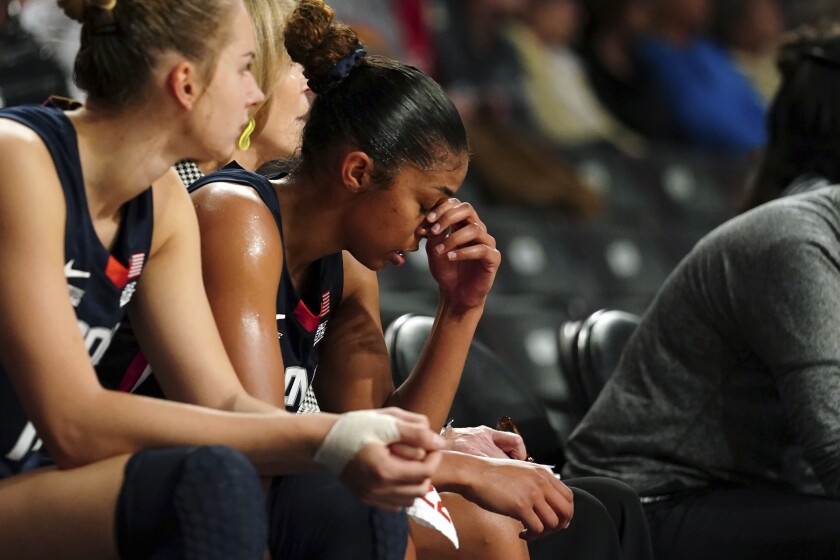 Connecticut guard Evina Westbrook (22) sits on the bench in the final moments of the team's loss to Georgia Tech in an NCAA college basketball game Thursday, Dec. 9, 2021, in Atlanta. (AP Photo/John Bazemore)