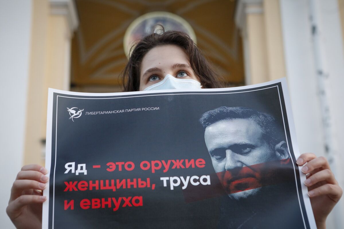 A supporter of Alexei Navalny protests in St. Petersburg, Russia, on Thursday.  