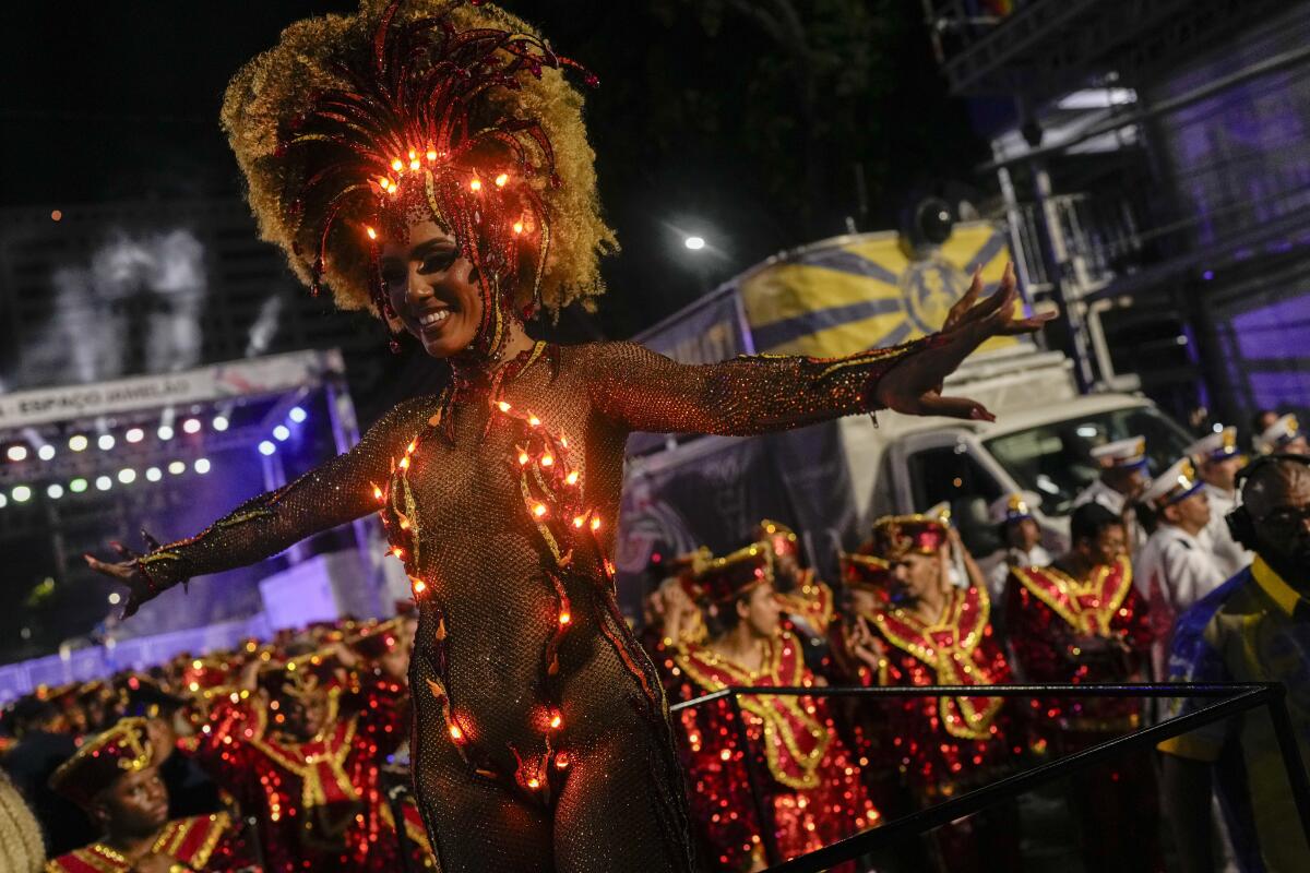 AP PHOTOS: A Carnival day in Brazil, from a morning street party to an  evening samba parade - The San Diego Union-Tribune